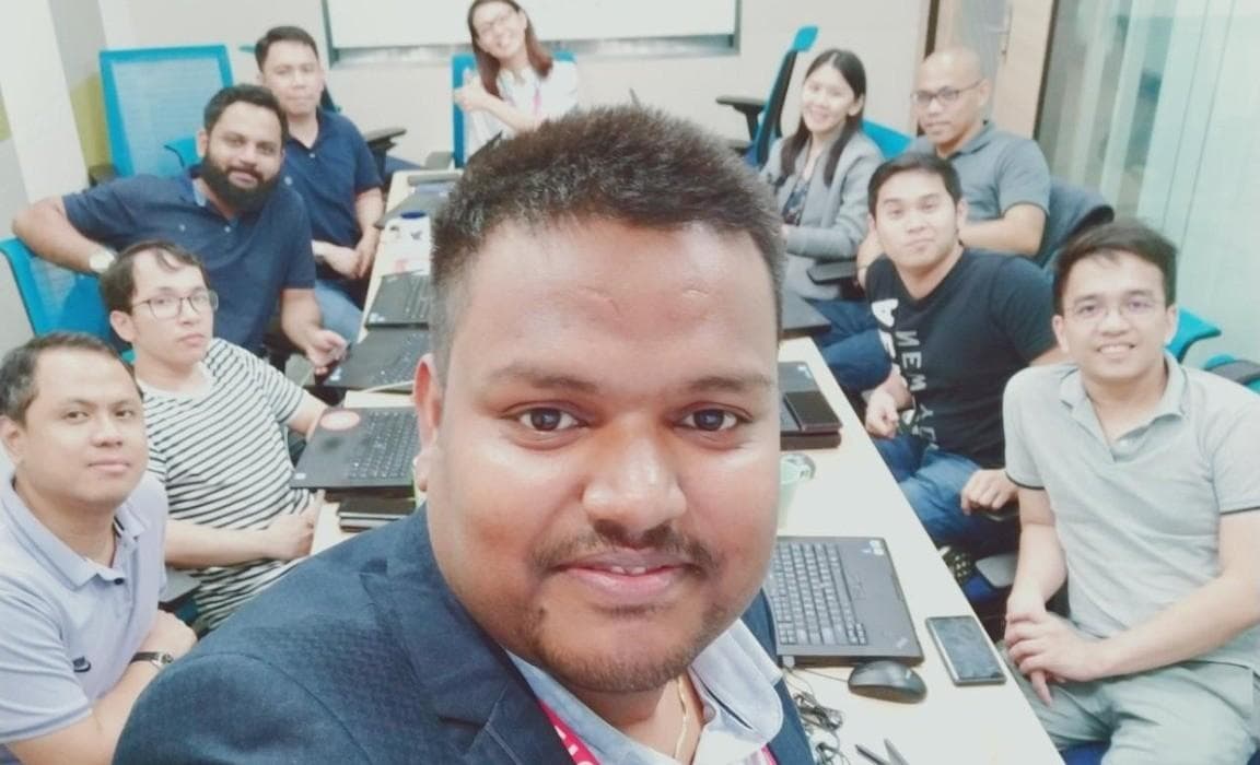 Deepesh Mishra with a hands-on learner cohort